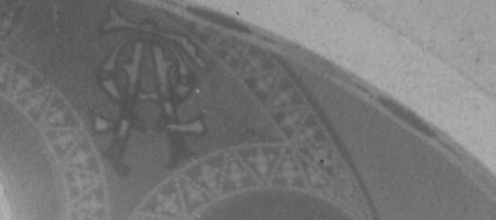 Detail above the chancel window right. Alpha and Omega symbolism. You can see it in the gallery on the #6 stained glass window